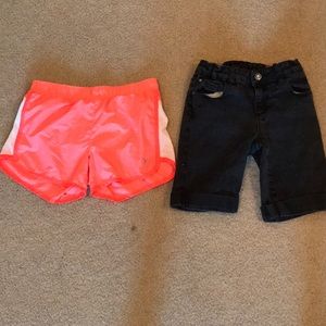 A pair of sport shorts and denim shorts.